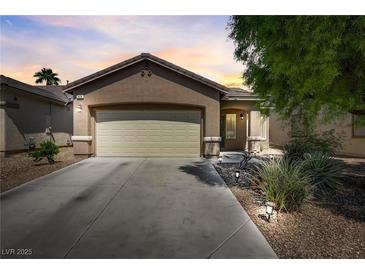 Charming single-story home with desert landscaping and a two-car garage at 448 Bright Moon Ave, North Las Vegas, NV 89084