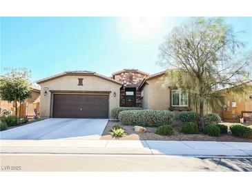 Charming single-story home featuring a well-manicured lawn and a two-car garage at 4837 Skyraider St, North Las Vegas, NV 89031