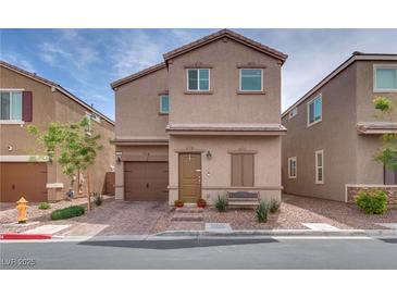Charming two-story home with brick driveway, desert landscaping and covered front porch at 5256 Sherwood Forest Ln, Las Vegas, NV 89122