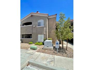 Well maintained two story condo featuring stucco exterior, red tile roof and low maintenance landscaping at 5525 W Flamingo Rd # 2037, Las Vegas, NV 89103