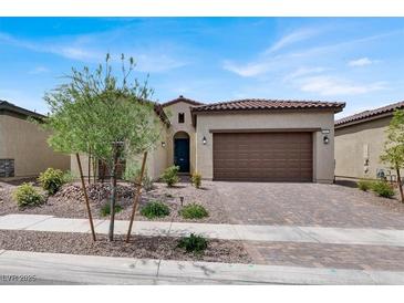 Charming single-story home featuring a tile roof, desert landscaping, and a two-car garage at 851 Klamath Springs St, Henderson, NV 89011