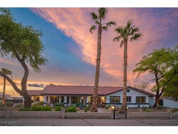 Charming single-story home with mature trees, beautiful landscaping, and a tiled roof at 8610 Mohawk St, Las Vegas, NV 89139