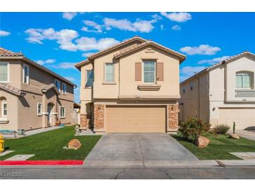 Charming two-story home with a well-manicured lawn and a two-car garage at 1618 Meno Peak St, Las Vegas, NV 89115