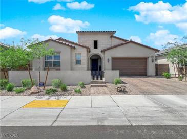 Charming single-story home featuring a well-kept front yard and an attached two-car garage at 253 Robledo St, Las Vegas, NV 89138