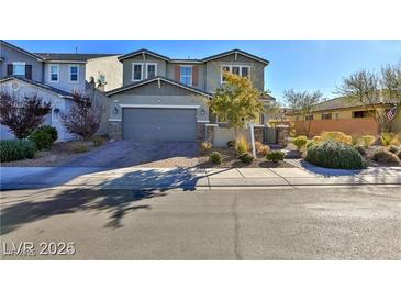 Charming two-story home with well-manicured landscaping and an attached two-car garage at 2832 Aragon Terrace Way, Henderson, NV 89044