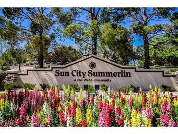 Inviting Sun City Summerlin entrance with colorful flowers in a well maintained Del Webb community at 3116 Richland Dr, Las Vegas, NV 89134