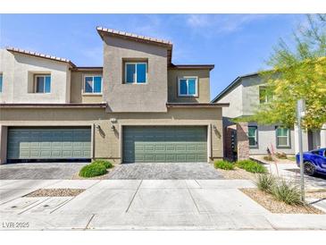 Two-story townhome with a modern design and desert landscaping for low maintenance at 4145 Lunar Canyon Ave, North Las Vegas, NV 89084