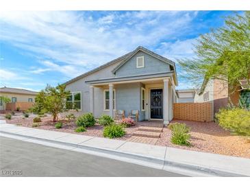 Charming single-story home with inviting front porch and landscaped front yard at 669 Assurance Pl, Henderson, NV 89011