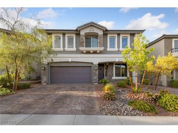 Charming two-story home featuring a well-manicured front yard and a spacious two-car garage at 7058 W Camero Ave, Las Vegas, NV 89113
