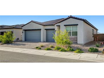 Charming single-story home featuring a two-car garage and drought-tolerant landscaping at 80 Brixton Ave, Henderson, NV 89011