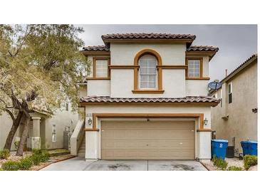 Charming two-story home with a tan exterior, tiled roof, and a convenient two-car garage at , Las Vegas, NV 89148