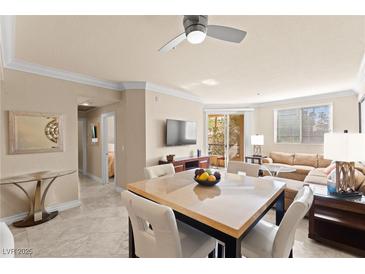 Inviting living room with comfortable seating, modern decor, and a dining area at 220 E Flamingo Rd # 111, Las Vegas, NV 89169