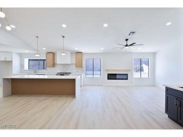 Open-concept kitchen boasts a large island, modern appliances, and ample counter space at 3156 Shadowridge Ave, Las Vegas, NV 89120