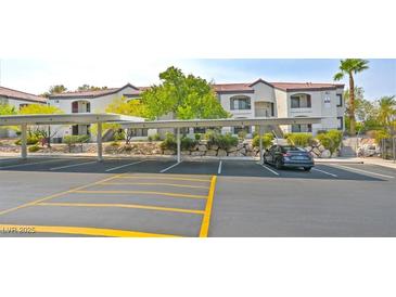 A condominium featuring covered parking, complemented by well-maintained landscaping and a clean facade at 950 Seven Hills Dr # 116, Henderson, NV 89052