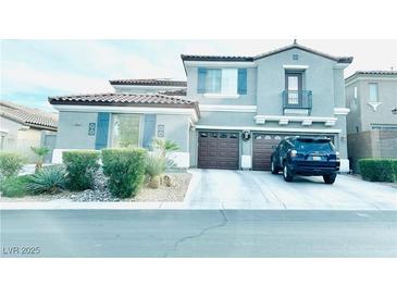 Charming two-story home features a two-car garage, and blue shutters, creating a welcoming curb appeal at 10013 Scenic Walk Ave, Las Vegas, NV 89149