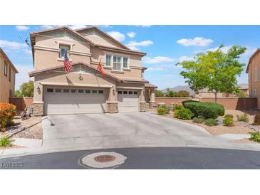 Inviting two-story home with a tandem three-car garage, neutral color palette, and a well-maintained concrete driveway at 150 Pocono Ranch Ave, North Las Vegas, NV 89031
