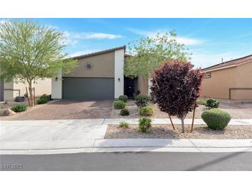 Charming single-story home showcasing a well-manicured front yard and a spacious two-car garage at 4505 Meline Ave, North Las Vegas, NV 89084