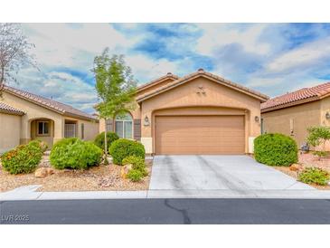 Charming single-story home featuring a well-maintained yard, a two-car garage, and inviting curb appeal at 6116 Tokara Ave, Las Vegas, NV 89122