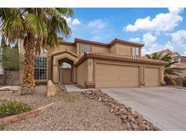 Charming two-story home featuring a three car garage and desert landscaping at 7808 Brook Valley Dr, Las Vegas, NV 89123