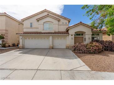 Charming two-story home with a spacious driveway and a well-maintained front yard at 9339 Bondeno St, Las Vegas, NV 89123