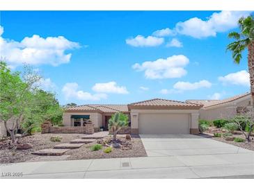 Charming single-story home with a well-manicured xeriscaped yard and beautiful desert landscaping at 2232 Beacon Ridge Dr, Las Vegas, NV 89134
