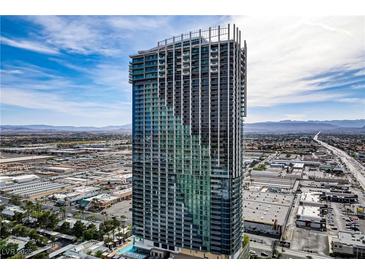 Stunning aerial view of a high-rise condo building in the city with gorgeous skyline and mountain views at 4381 W Flamingo Rd # 27308, Las Vegas, NV 89103