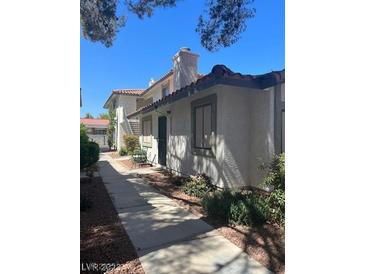 The exterior of the building features a well-maintained landscape and a sidewalk leading to the entrance at 6749 W Charleston Blvd # 2, Las Vegas, NV 89146