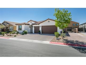 Charming single-story home with a two-car garage and well-maintained landscaping at 7821 Mazarine St, North Las Vegas, NV 89084