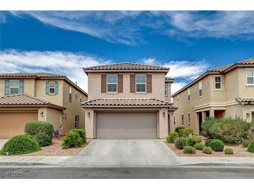 Charming two-story home with tile roof, attached garage, and well-maintained landscaping in a desirable neighborhood at 900 Harbor Ave, Henderson, NV 89002