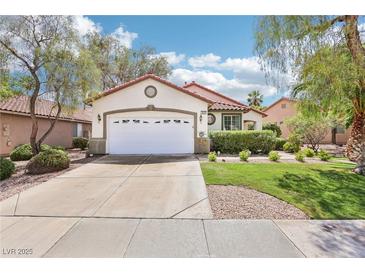 Charming single-story home featuring a well-maintained lawn and an attached two-car garage at 3029 Paseo Hills Way, Henderson, NV 89052