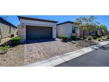 Charming single-Gathering home with brick paver driveway and desert landscaping at 8550 Lost Pony St, Las Vegas, NV 89148