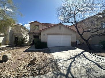 Charming two-story home with a two-car garage and a low-maintenance desert landscape at 3728 Ashling St, Las Vegas, NV 89129