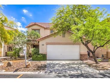 Two-story home showcasing a well-maintained yard and two-car garage at 3728 Ashling St, Las Vegas, NV 89129