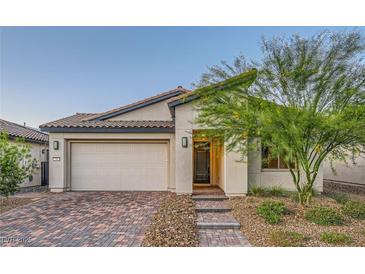 Charming single-story home featuring a two-car garage and desert landscaping at 26 Sun Mirage Ave, Henderson, NV 89011