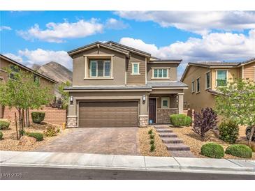 Charming two-story home with landscaped front yard and a two-car garage in a desirable neighborhood at 2711 Evolutionary Ln, Las Vegas, NV 89138