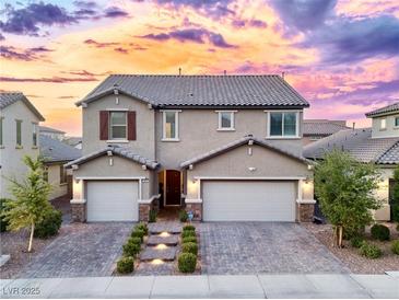 Inviting two-story home boasting a two-car garage and beautifully paved driveway at 3846 W Neal Ave, Las Vegas, NV 89141