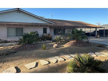 Charming single-story home with desert landscaping and mature palm trees in the front yard at 5352 Eugene Ave, Las Vegas, NV 89108