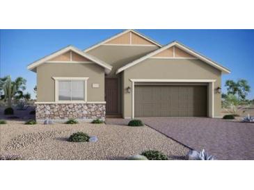 Charming single-story home with stone accents, desert landscaping, and attached two-car garage at 85 Sonata Dawn Ave, Henderson, NV 89011
