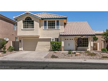 Charming two-story home featuring a tile roof, attached two-car garage, and well-maintained front yard at 9044 Crimson Clover Way, Las Vegas, NV 89134