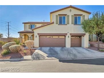 Charming two-story home featuring a terracotta-colored tile roof and a spacious two-car garage at 10611 Auburn Springs Ave, Las Vegas, NV 89166