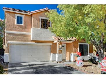 Charming two-story home featuring a two-car garage and a welcoming entrance; holiday decor on display at 11117 Romola St, Las Vegas, NV 89141
