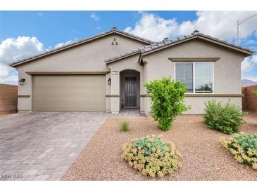 Charming single-story home with a well-maintained front yard and a two-car garage at 1265 Inward Hill St, Henderson, NV 89002