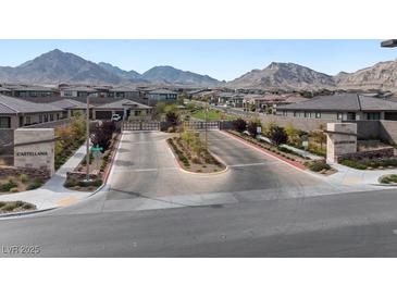 View of Castellana community entrance with lush landscaping and mountain views at 127 Medianoche St, Las Vegas, NV 89138