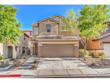 Inviting two-story home with a well-maintained front yard and a two-car garage at 137 Desert Pond Ave, Henderson, NV 89002