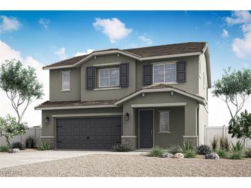 Charming two-story home with a two-car garage and well-maintained landscaping at 3228 Walker River St, North Las Vegas, NV 89032