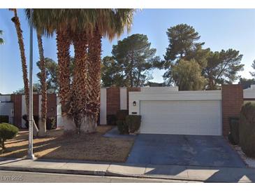 A single story home featuring mature landscaping and a two car garage at 3717 Casey Dr, Las Vegas, NV 89120