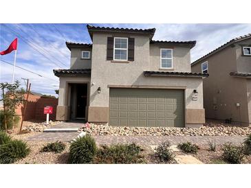 Charming two-story home featuring a two car garage, neutral stucco facade, and inviting landscape at 5151 Capucina St # Lot 1, Las Vegas, NV 89122