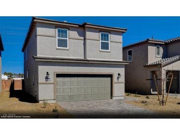Charming two-story home boasts a neutral color palette and a convenient two-car garage for modern living at 5169 Capucina St # Lot 4, Las Vegas, NV 89122