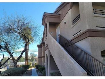 Exterior view of the condo showing the stairs leading up to the unit at 5750 E Hacienda Ave # 117, Las Vegas, NV 89122