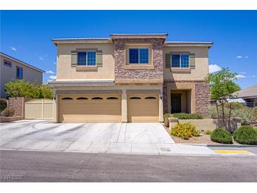 Charming two-story home with a three-car garage and desert landscaping at 776 Flowing Meadow Dr, Henderson, NV 89014